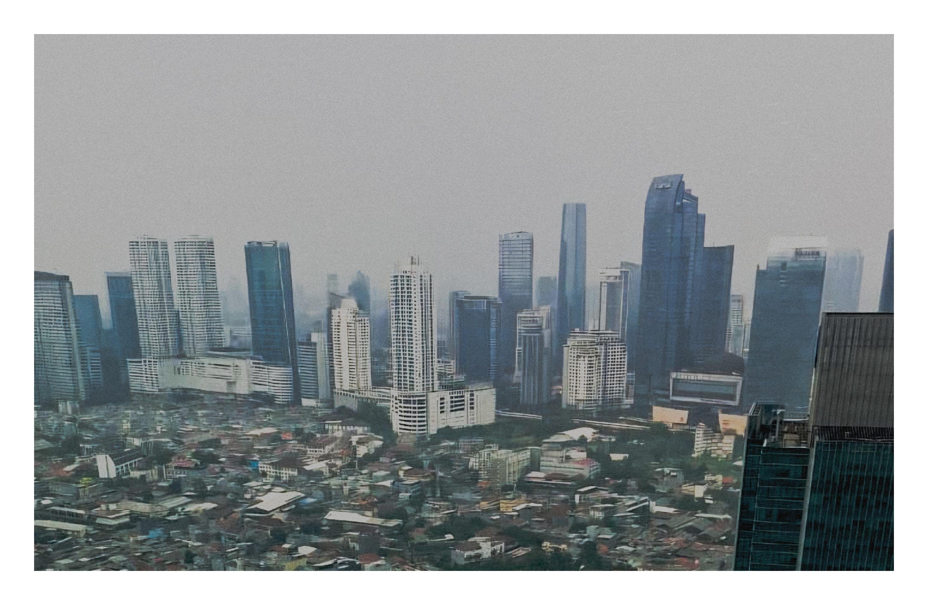 Hazy city skyline with modern high-rise skyscrapers in the background and a dense cluster of low-rise buildings in the foreground, viewed from an elevated vantage point.