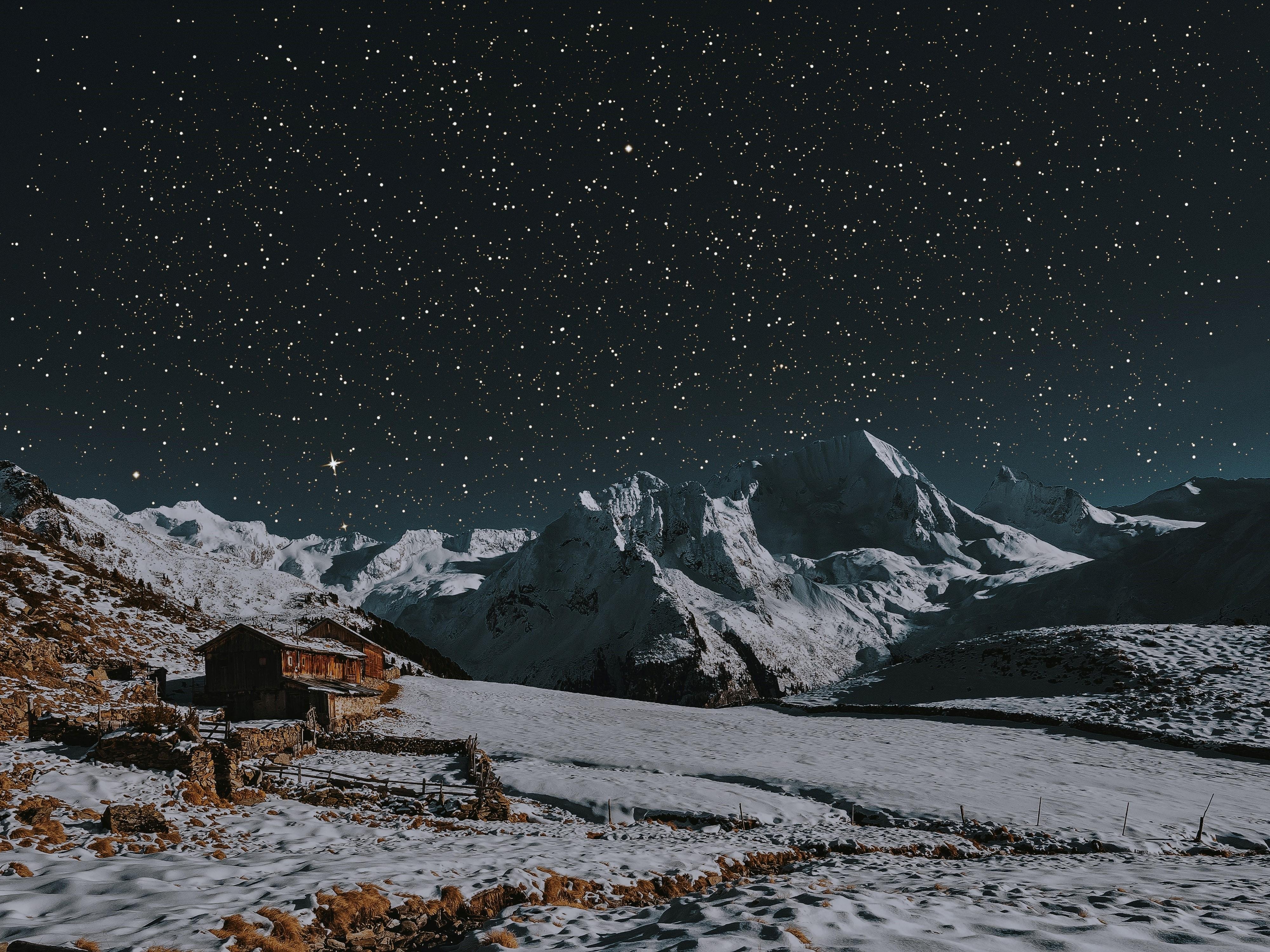 winter scenery with stars and mountains