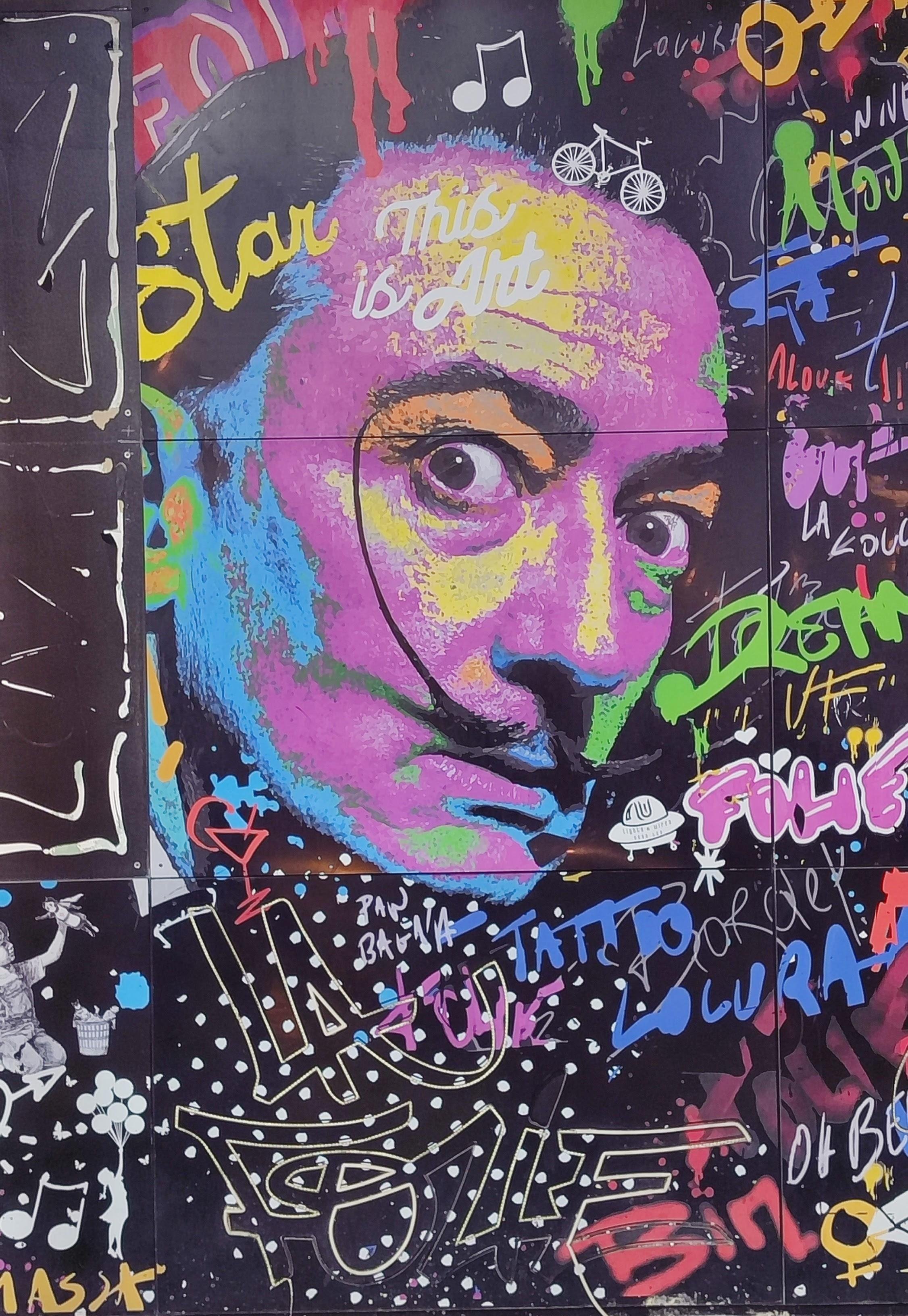 A beautiful graffiti with a portrait of Salvador Dalí, captured in the beautiful old town of Alicante in Spain.