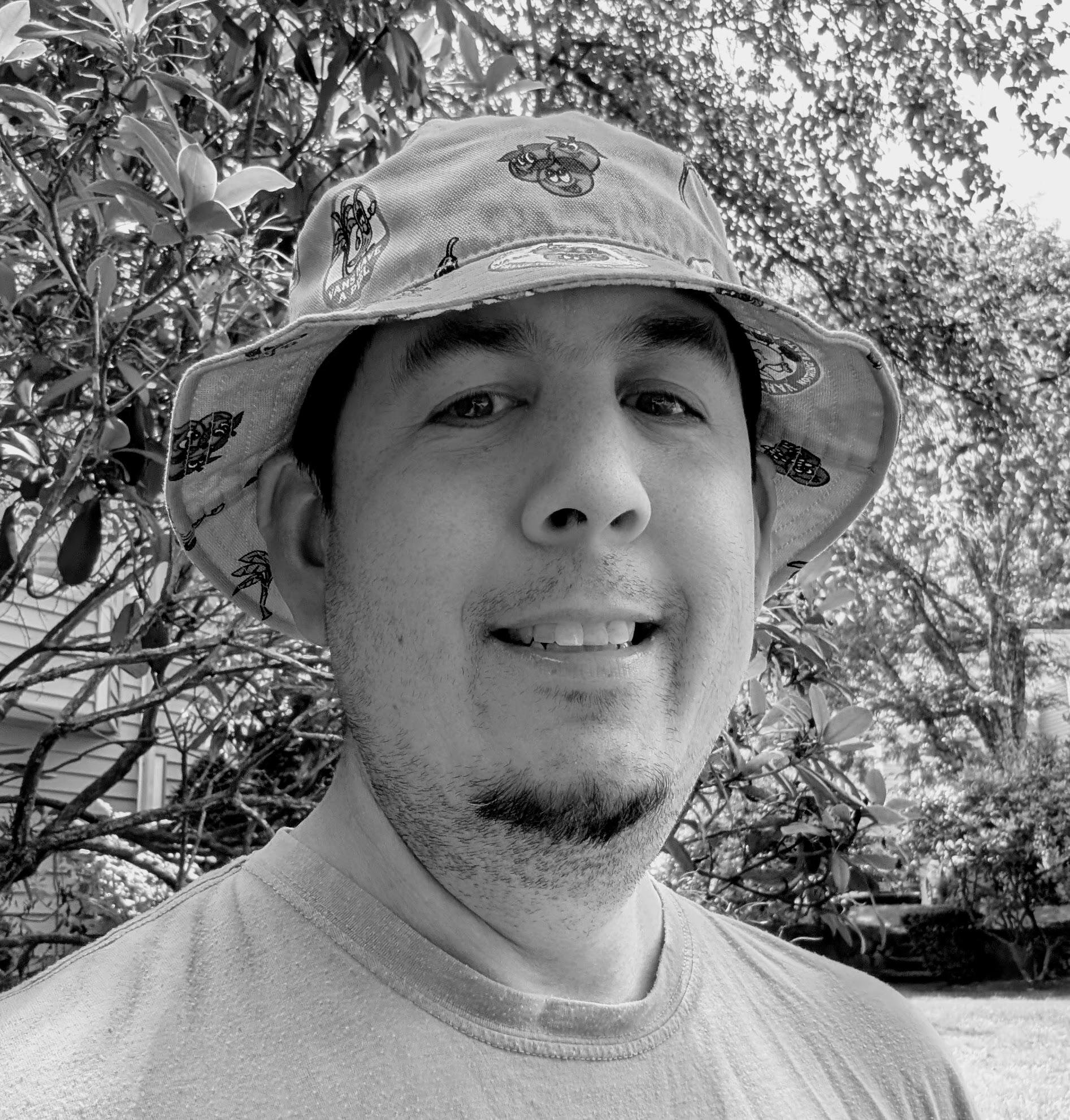 a white male with a bucket hat on all in black and white