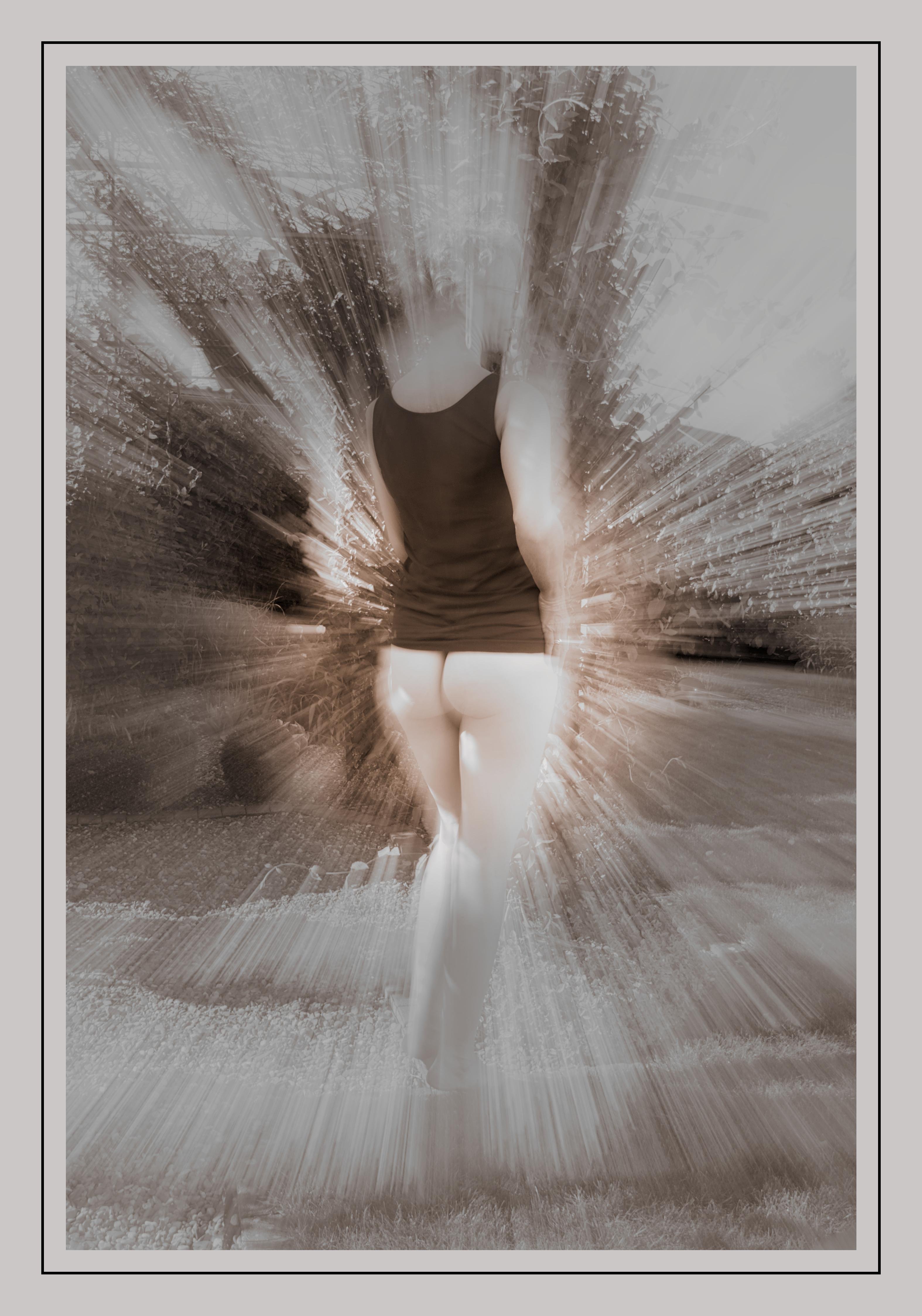 The image is an artistic representation showcasing a person in a black top, with an effect that creates a motion blur radiating outwards. The style gives it a dynamic and abstract feel, focusing on the silhouetted figure in contrast to the background.