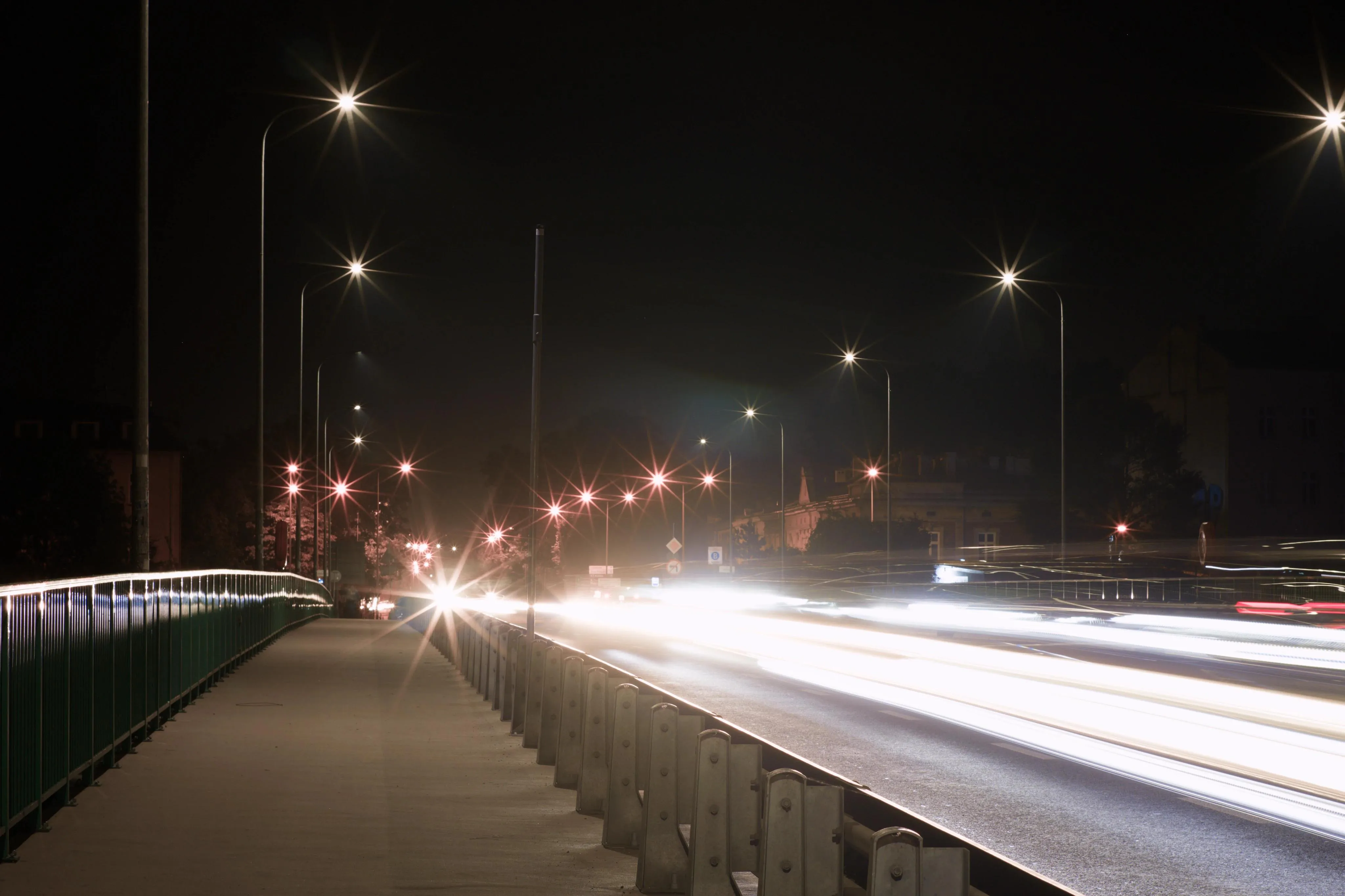A photo of light rays on a bridge