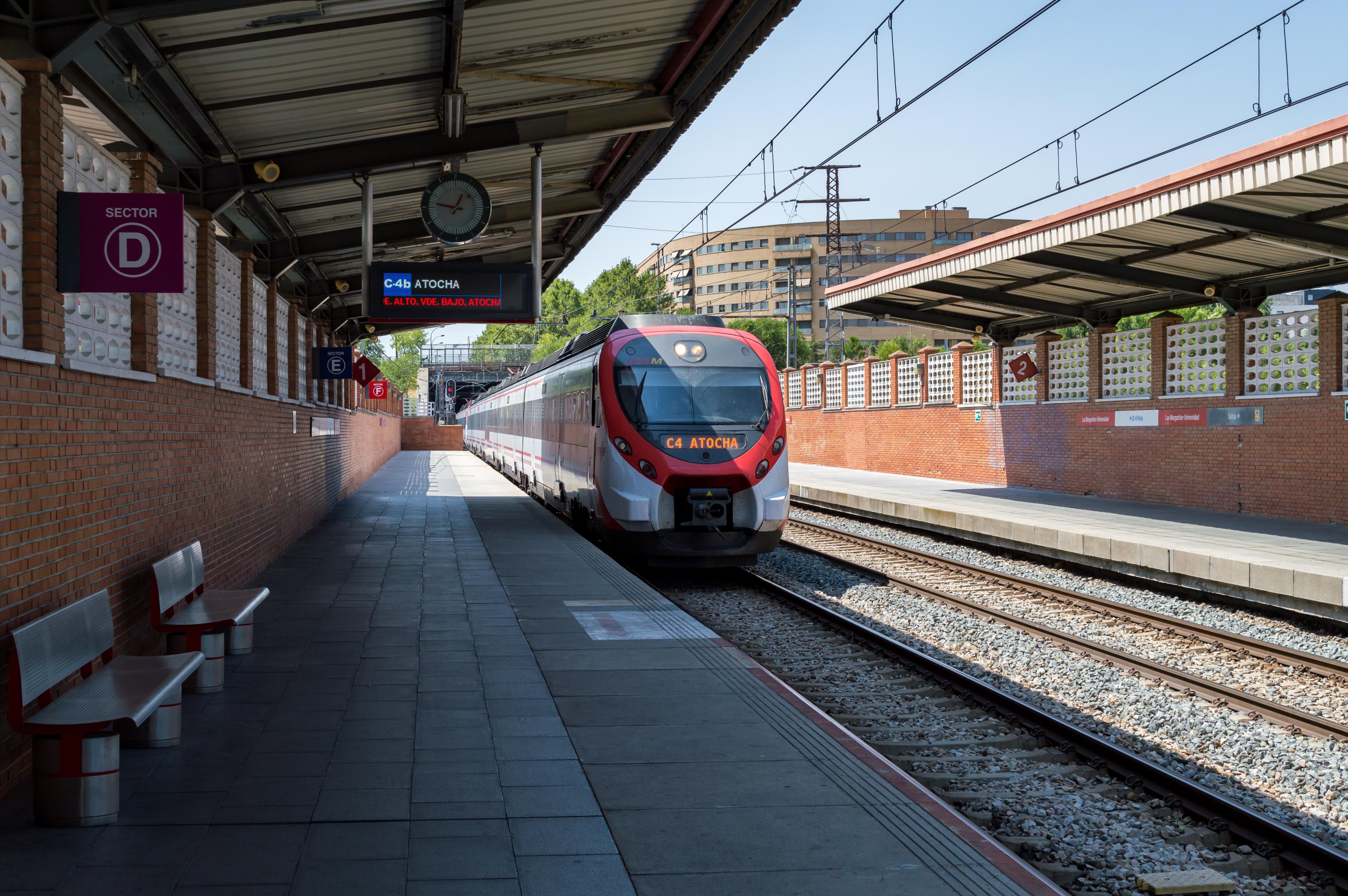 Cercanias Madrid train at Las Margaritas – Universidad station. It's a line C4 towards Atocha