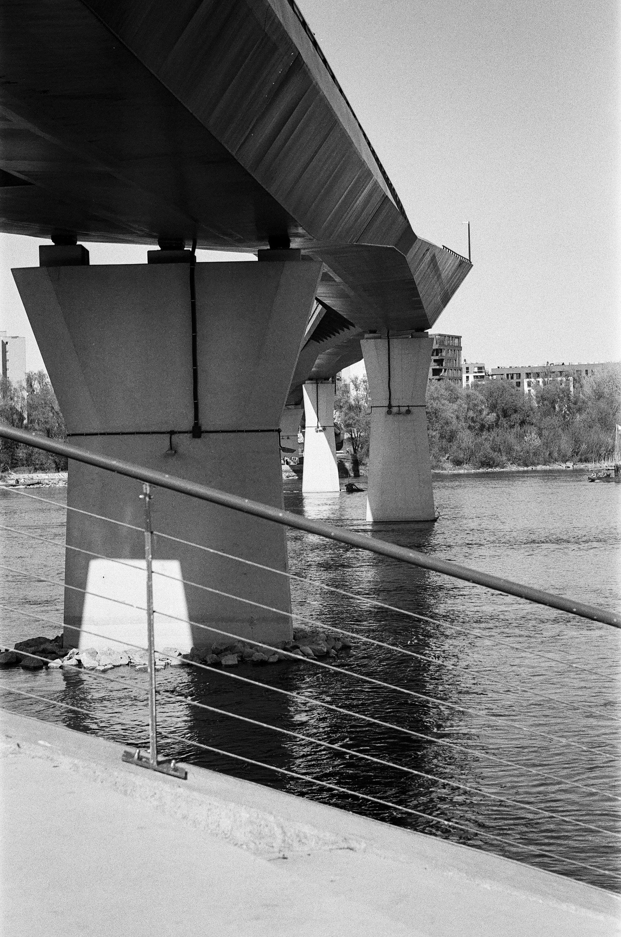 B&W film photo of a pedestrian & bicycle bridge on Vistula, Warsaw