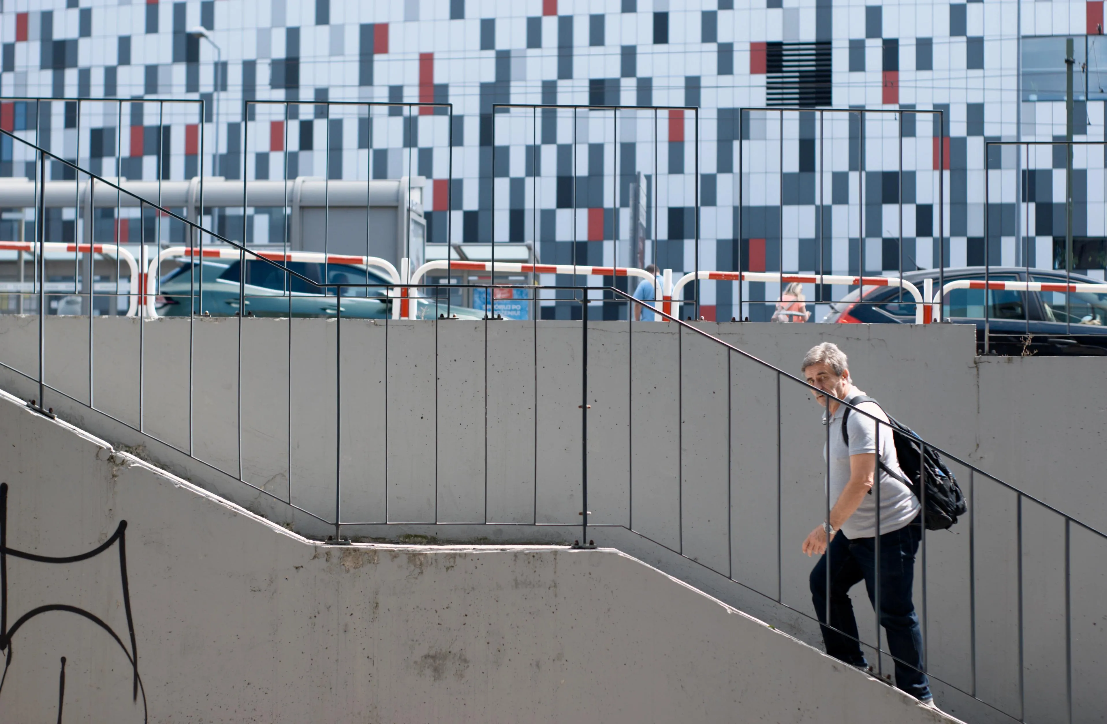 A photo of a man walking up the stairs