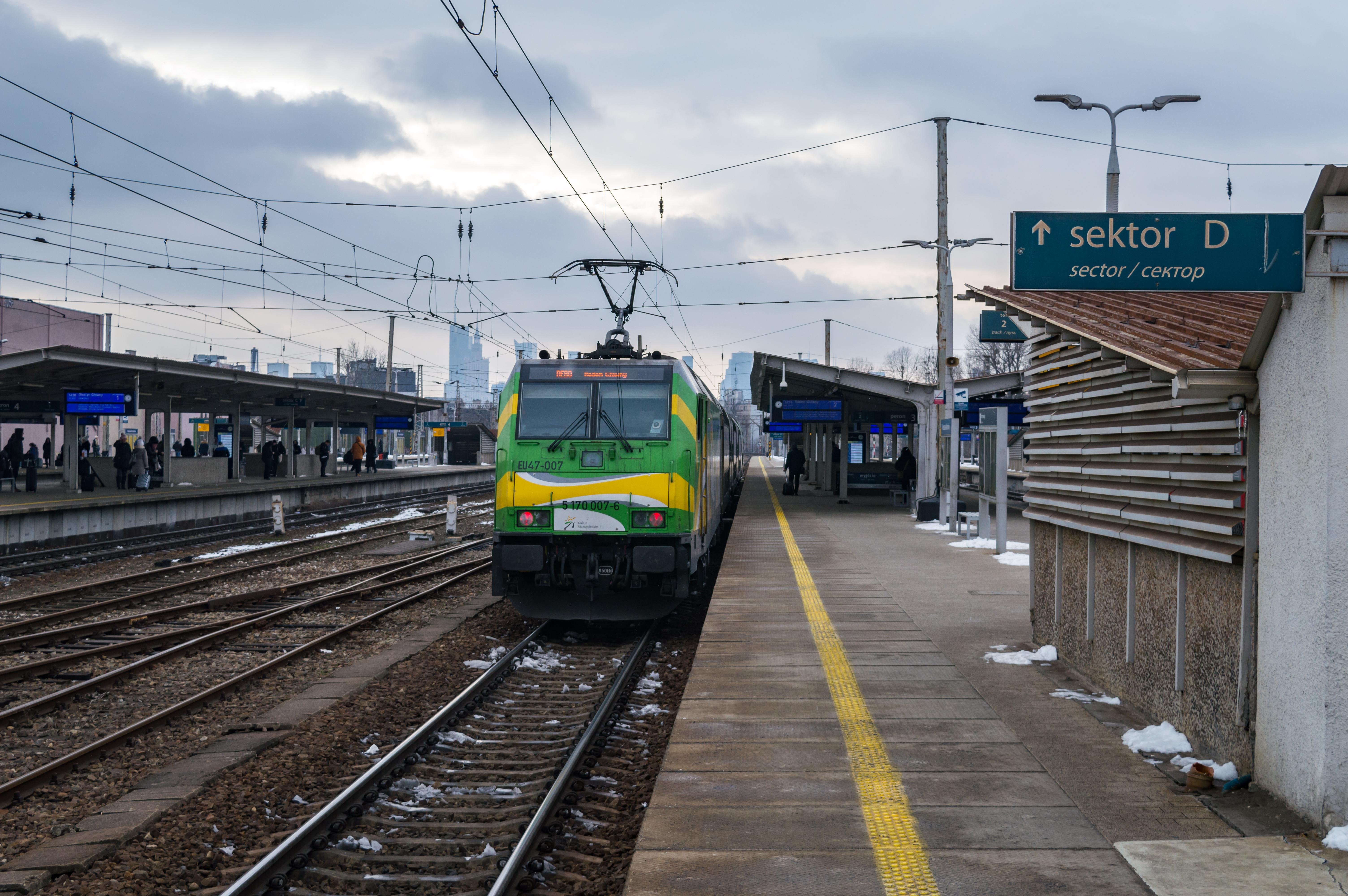 Alstom Traxx locomotive of KM with a double-decker train at Warsaw East station