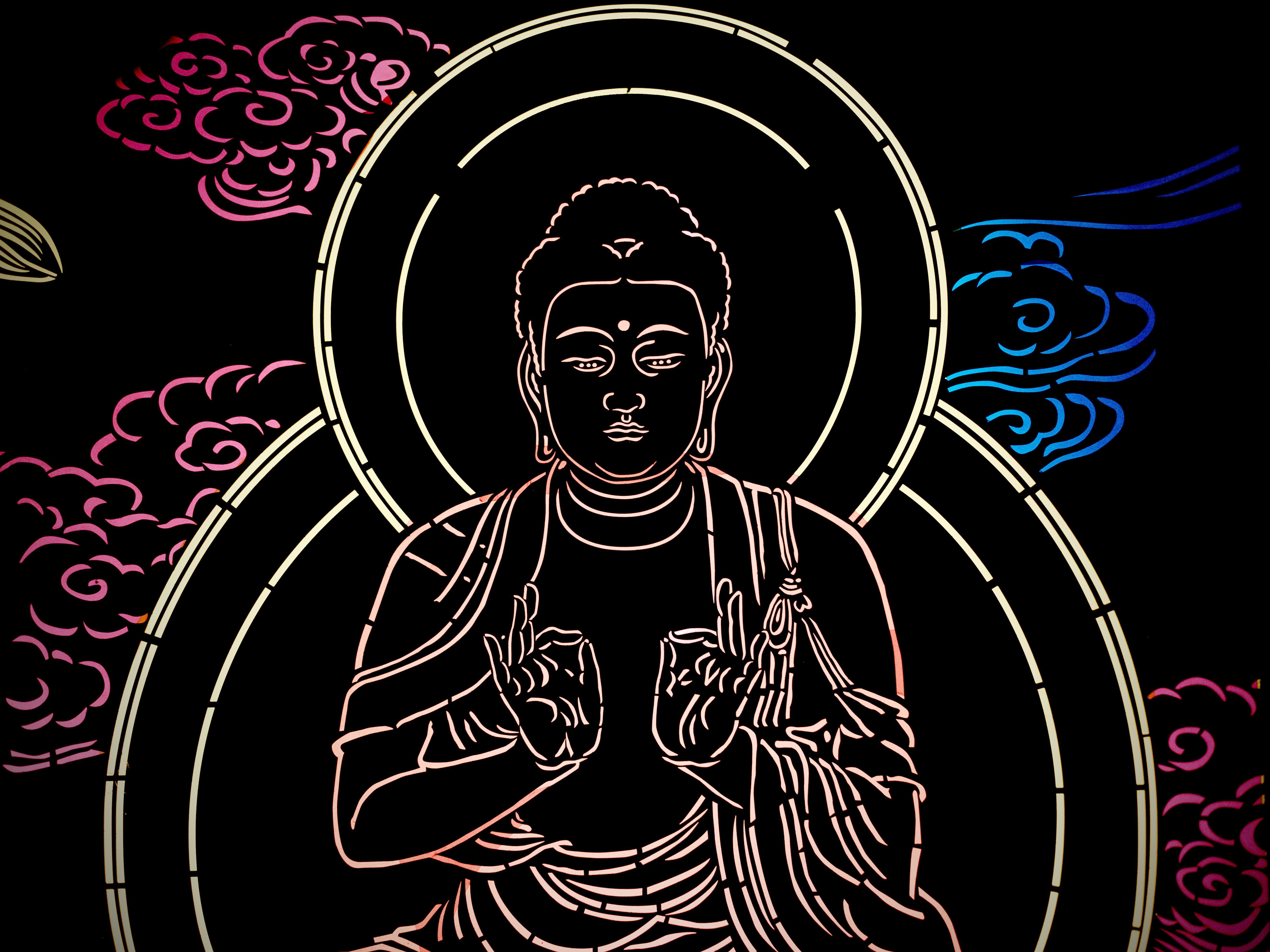 A Buddha drawn using light strips in complete darkness, surrounded by patterns drawn in the same style.